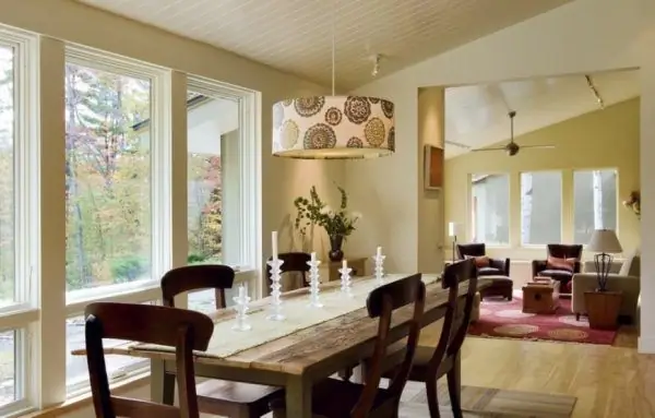 Chandelier over the table with fabric lampshade