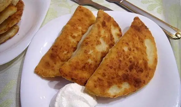 Chebureks on curd dough