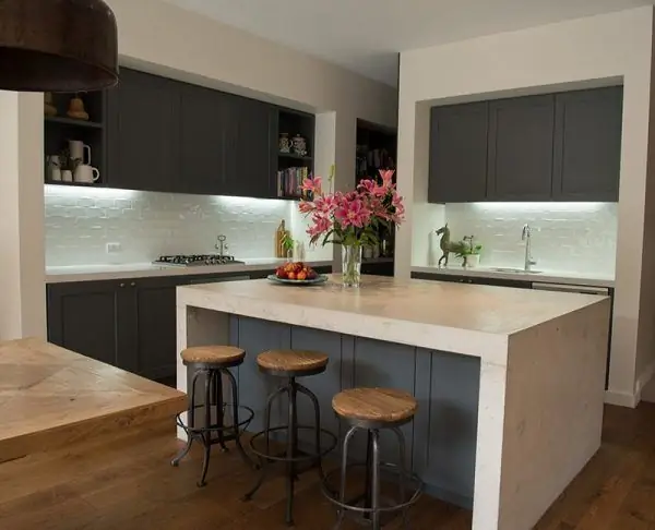 Kitchen with a large table in the center