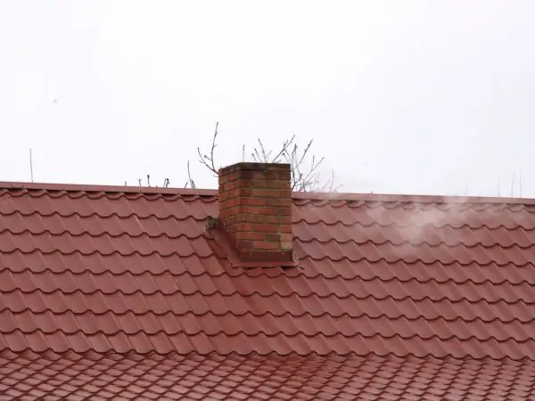 Chimney outlet near the roof ridge